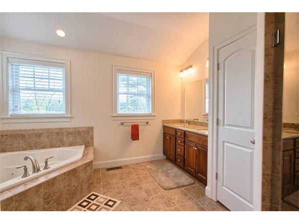 36 Indian Ridge Terrace, Unit 36 Westford, MA 01886 - Photo 14 of 23 a bathroom with a tub sink and a window