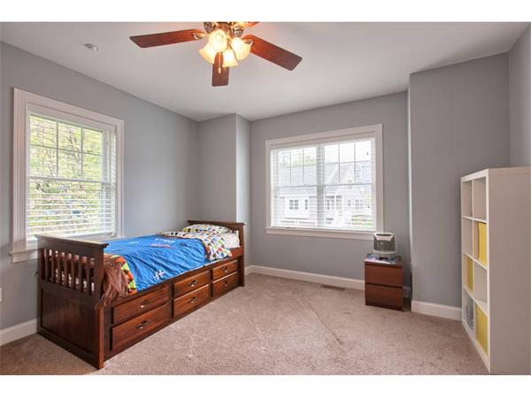 36 Indian Ridge Terrace, Unit 36 Westford, MA 01886 - Photo 17 of 23 a bedroom with a bed and a chandelier