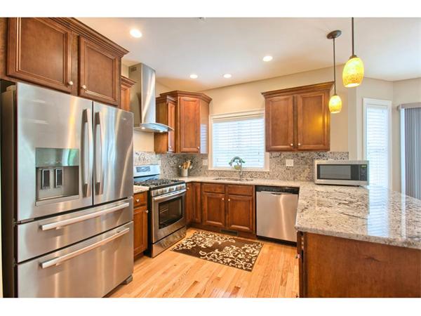 36 Indian Ridge Terrace, Unit 36 Westford, MA 01886 - Photo 2 of 23 a kitchen with stainless steel appliances granite countertop a refrigerator a stove and a sink