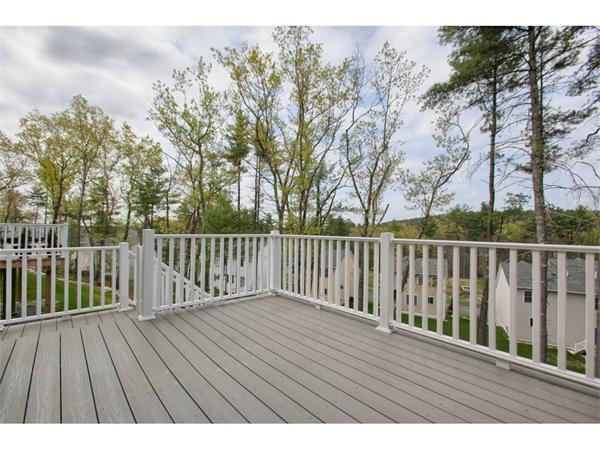 36 Indian Ridge Terrace, Unit 36 Westford, MA 01886 - Photo 21 of 23 a view of balcony with wooden floor