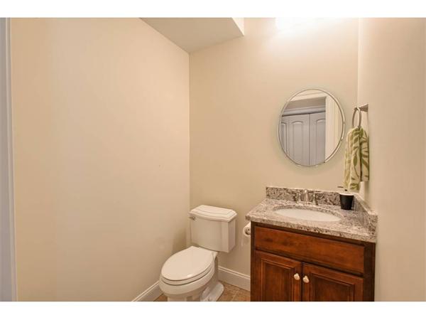36 Indian Ridge Terrace, Unit 36 Westford, MA 01886 - Photo 10 of 23 a bathroom with a toilet a sink and mirror