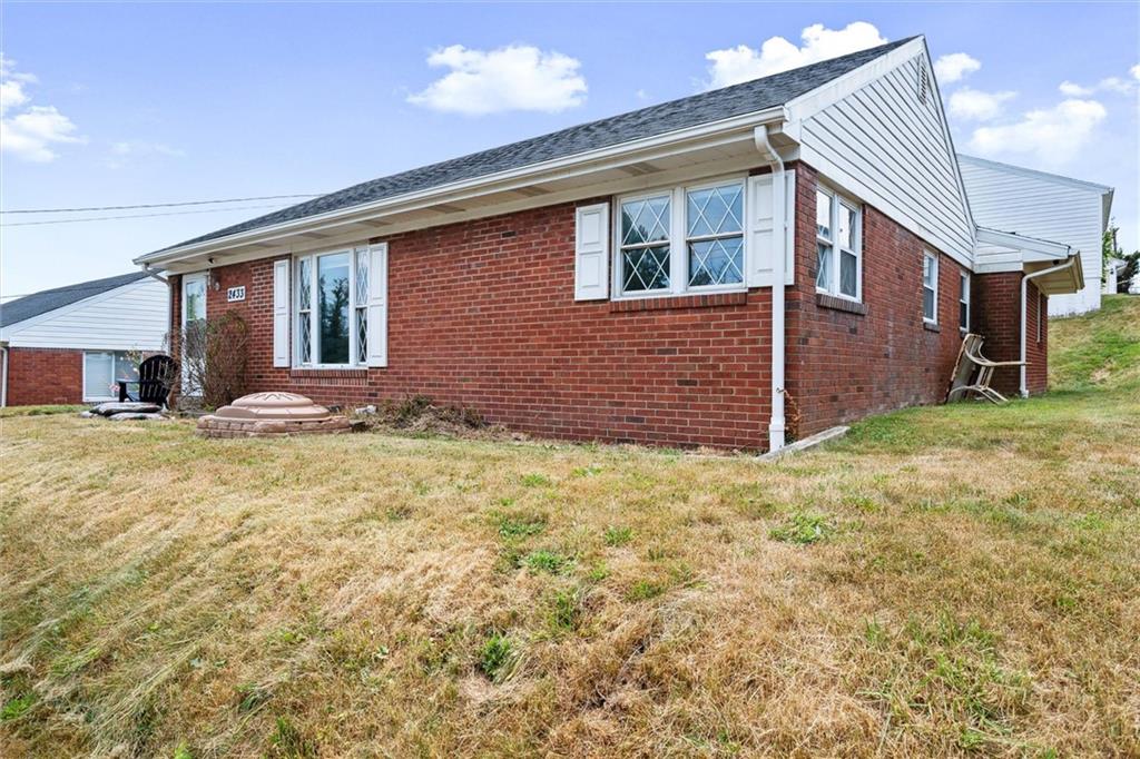2433 Brodhead Road Aliquippa, PA 15001 - Photo 4 of 37 a front view of a house with a yard