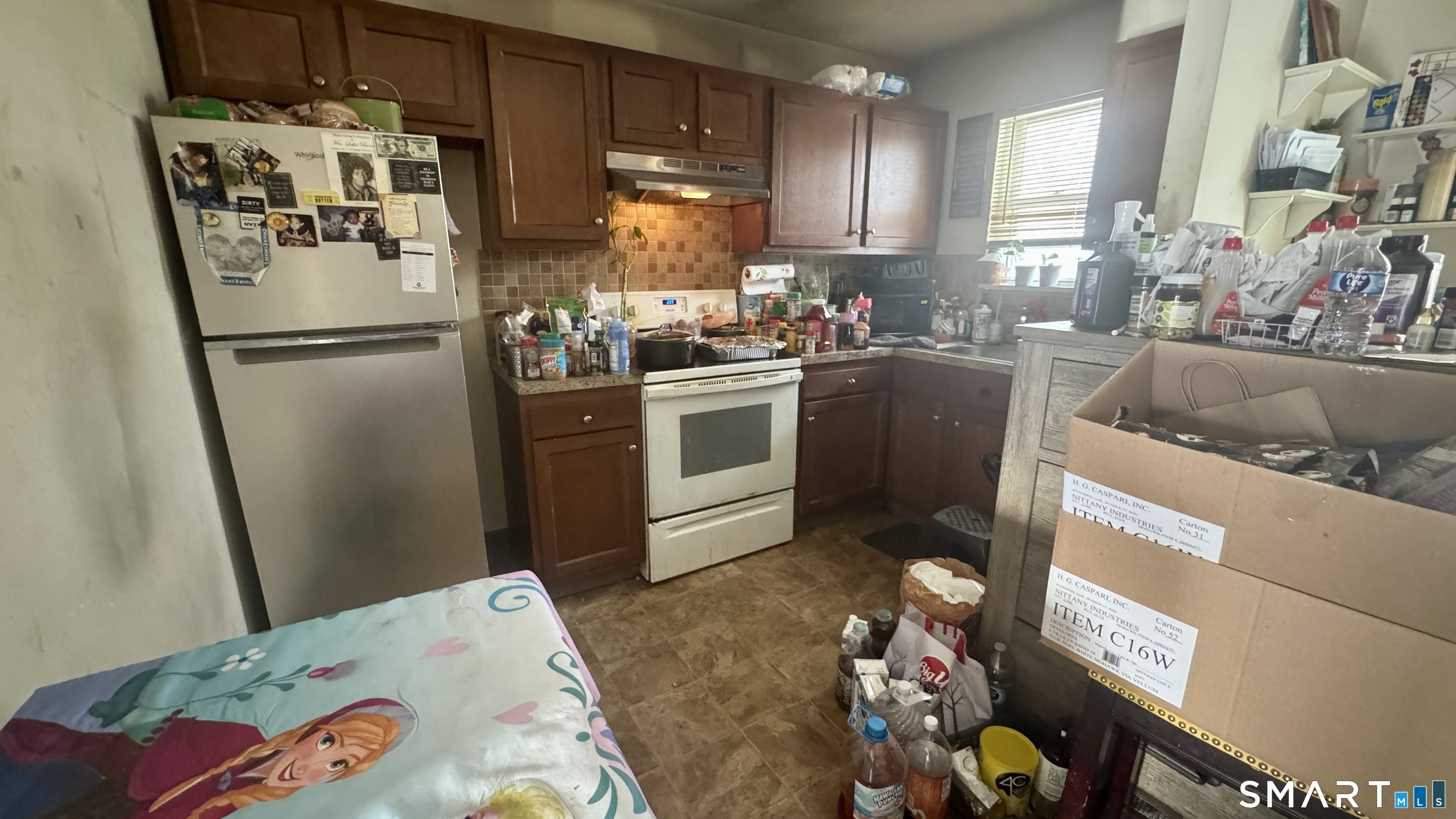 49 Ridge Road, Unit 2 Naugatuck, CT 06770 - Photo 3 of 7 a kitchen with stainless steel appliances granite countertop a refrigerator a sink and a stove
