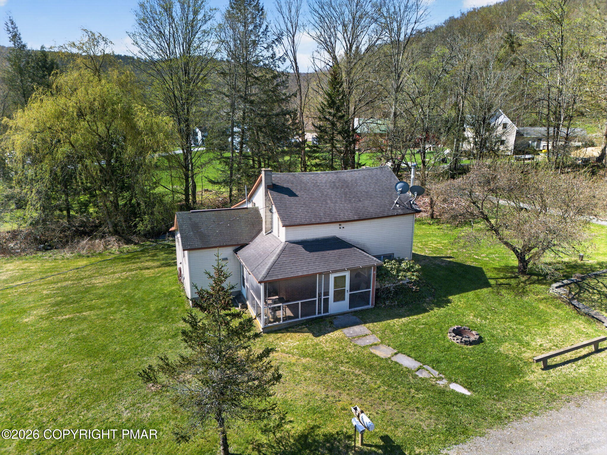a aerial view of a house with a big yard