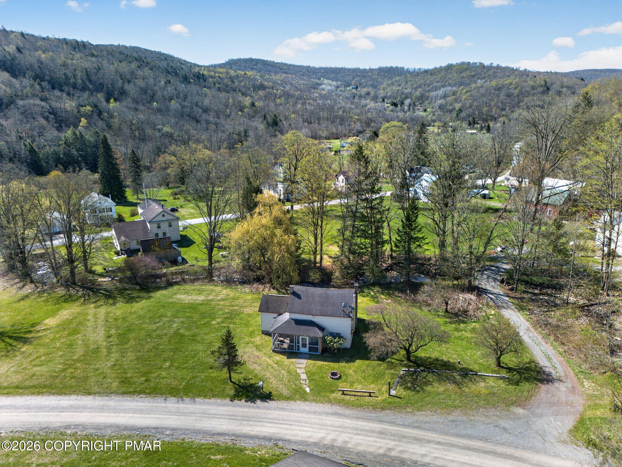 448 Criddle Road Susquehanna, PA 18847 - Photo 11 of 55 an aerial view of a house with yard swimming pool and mountain view