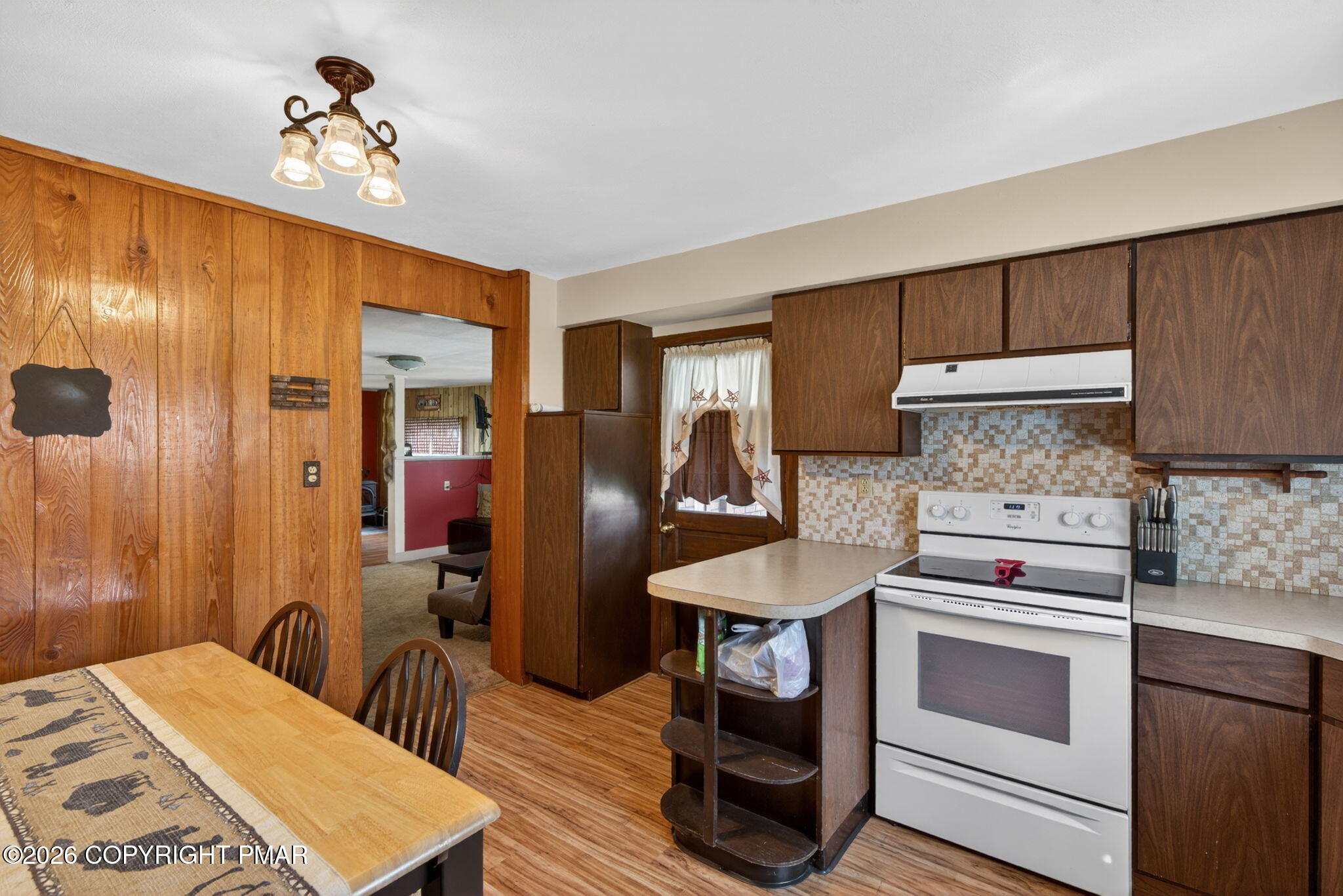 448 Criddle Road Susquehanna, PA 18847 - Photo 23 of 55 a kitchen with stainless steel appliances a stove a refrigerator and cabinets