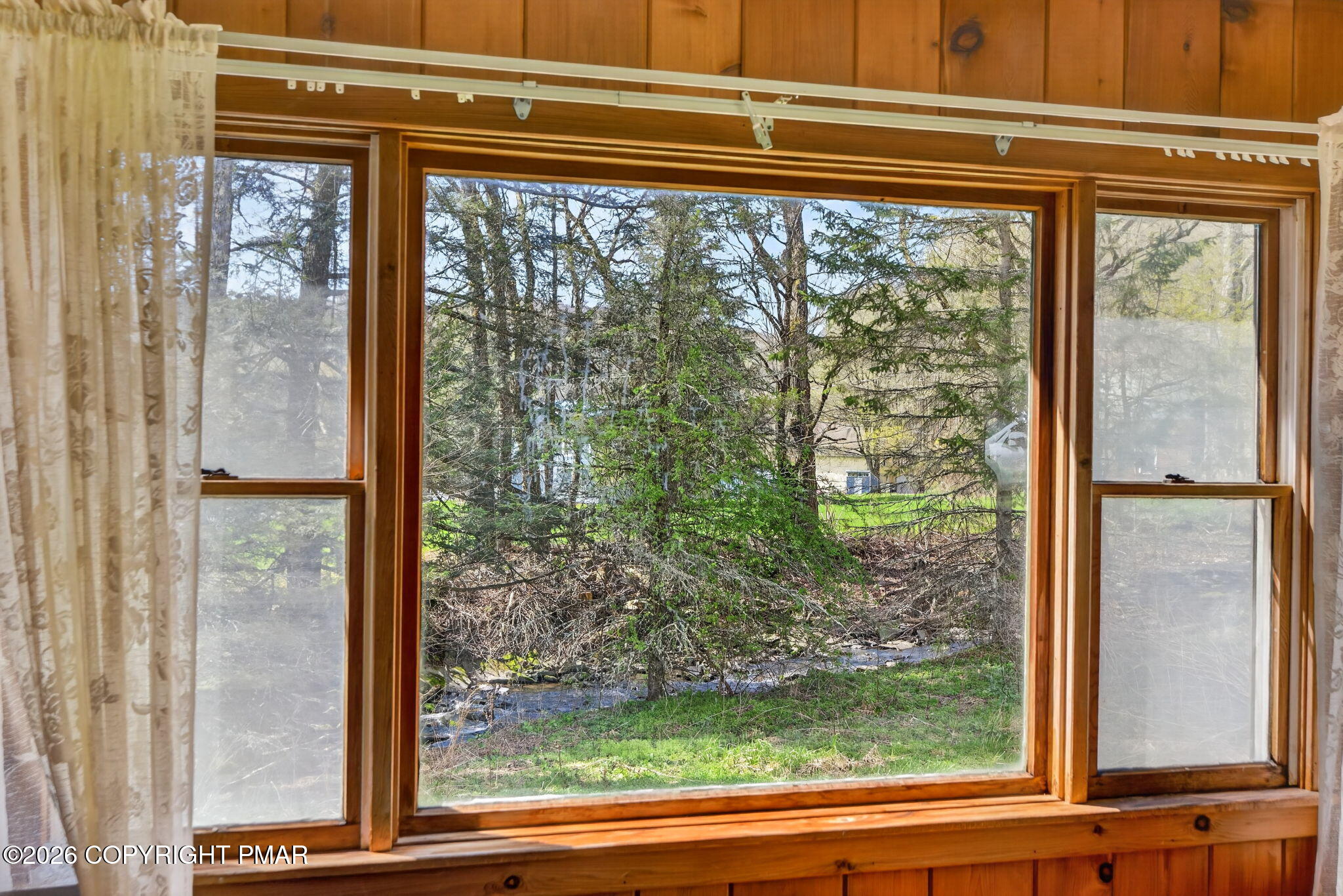 448 Criddle Road Susquehanna, PA 18847 - Photo 38 of 55 a view of a room that has a large window and a bed