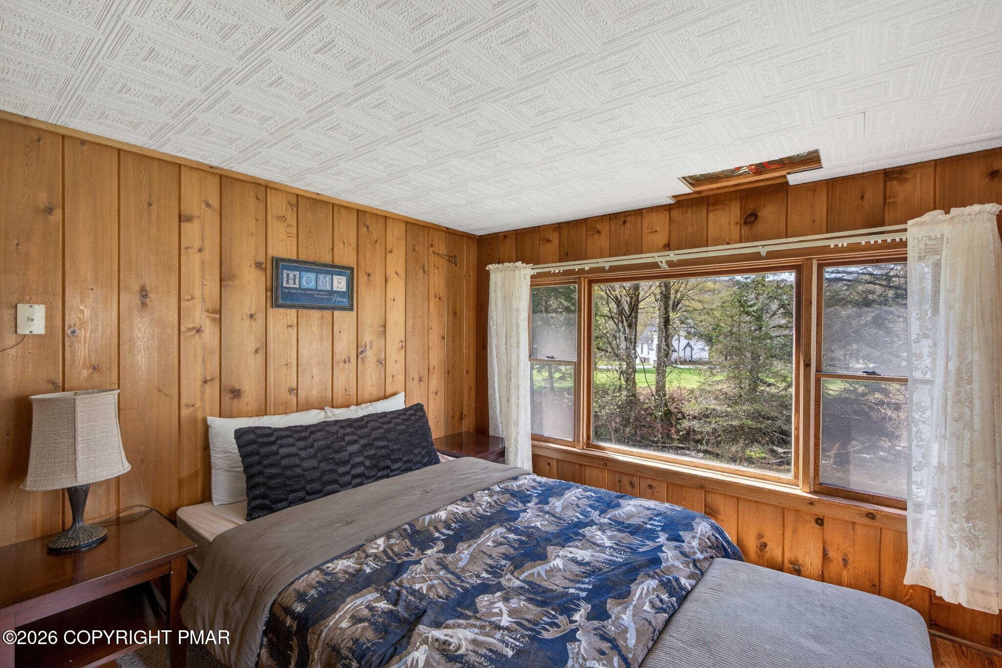 448 Criddle Road Susquehanna, PA 18847 - Photo 39 of 55 a bedroom with a large bed and a window
