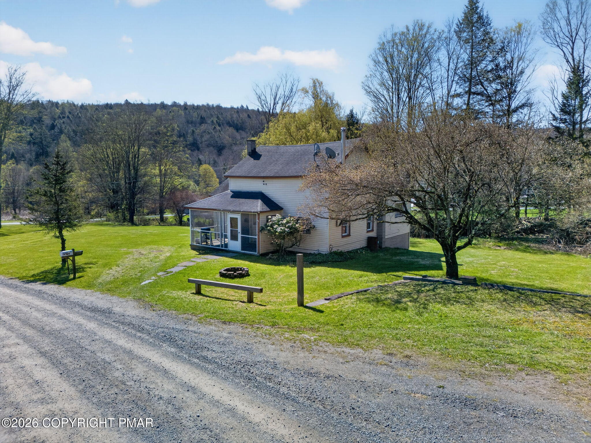 448 Criddle Road Susquehanna, PA 18847 - Photo 4 of 55 a green field with lots of tress in it