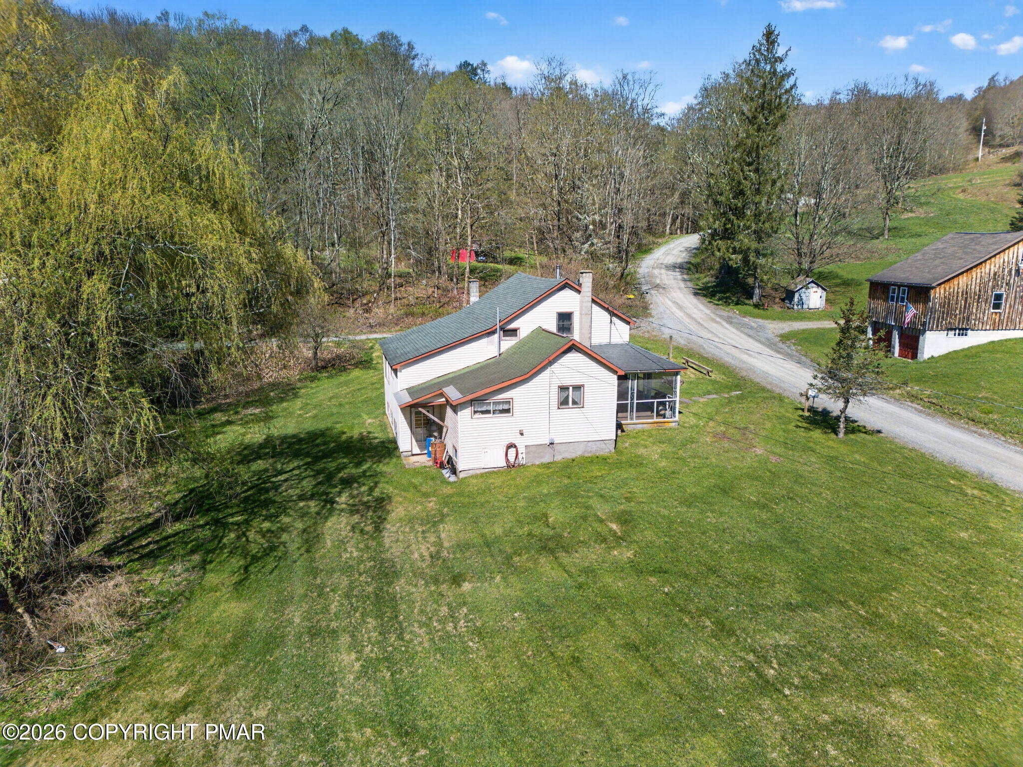 448 Criddle Road Susquehanna, PA 18847 - Photo 7 of 55 a house view with a garden space