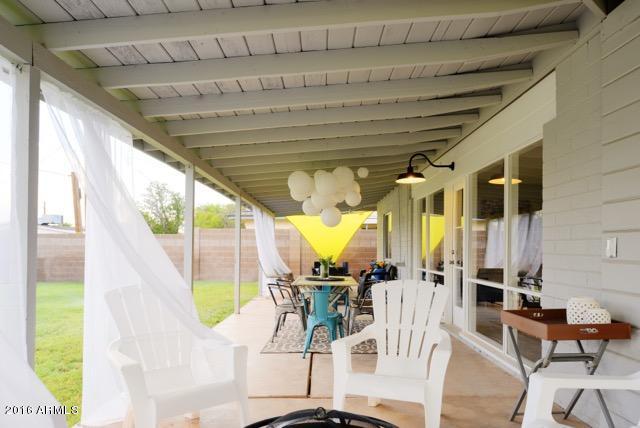 825 West Picadilly Road Phoenix, AZ 85013 - Photo 35 of 36 Patio View with Lanterns and Sheers