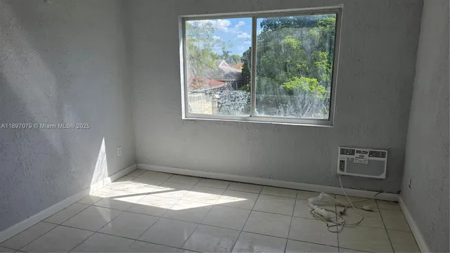 a view of a room with a window