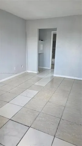 a view of an empty room with a sink