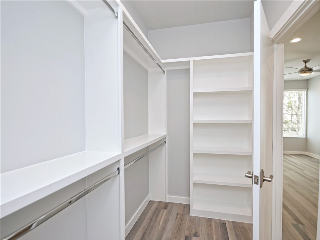 2108 Tillery Street, Unit 2102 Austin, TX 78723 - Photo 12 of 26 The walk-in closet has an awesome storage system to display your clothing and accessories.