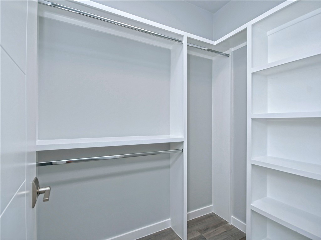 2108 Tillery Street, Unit 2102 Austin, TX 78723 - Photo 19 of 26 The second bedroom closet has plenty of shelving for storage.