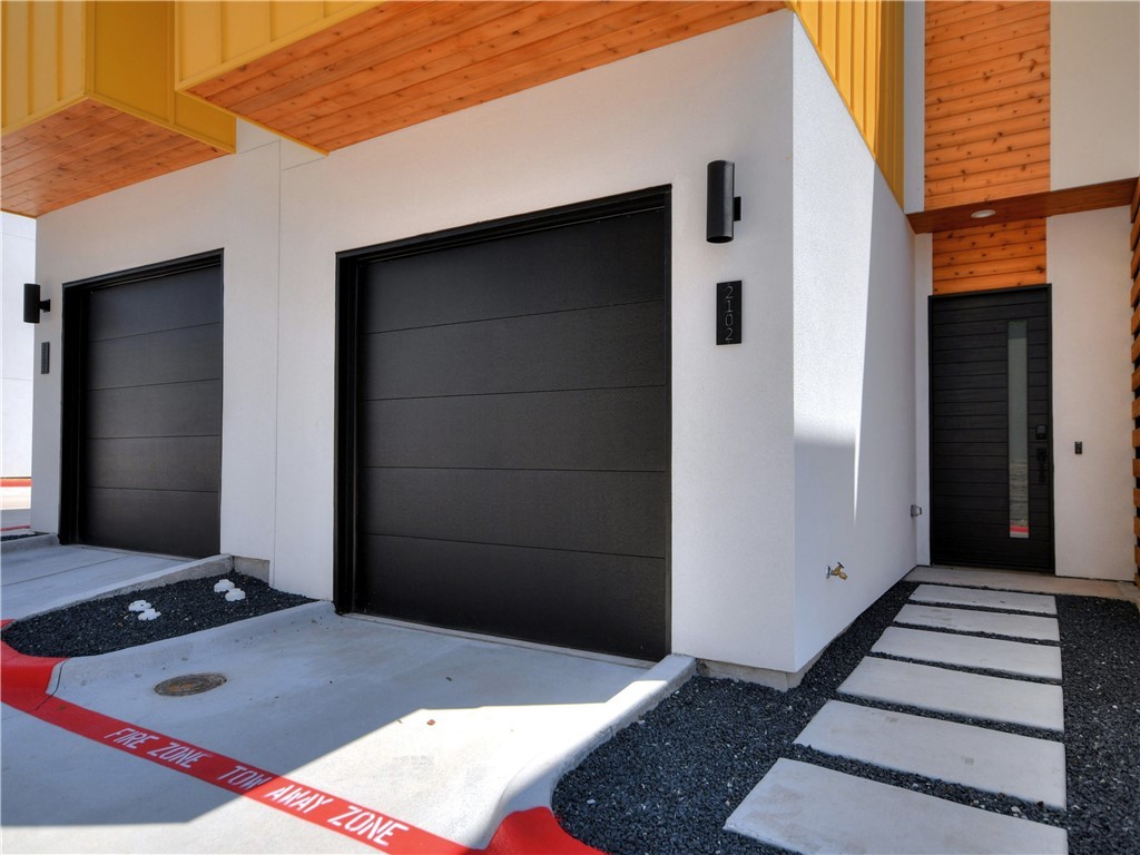 2108 Tillery Street, Unit 2102 Austin, TX 78723 - Photo 23 of 26 The home offers a beautiful urban exterior and an attached 1-car garage.