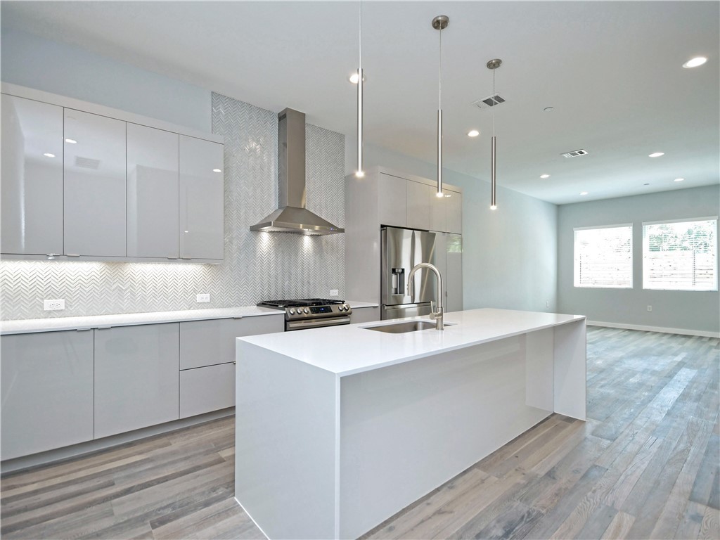 2108 Tillery Street, Unit 2102 Austin, TX 78723 - Photo 3 of 26 There is an abundance of cabinetry for storage and counter space for preparing meals.
