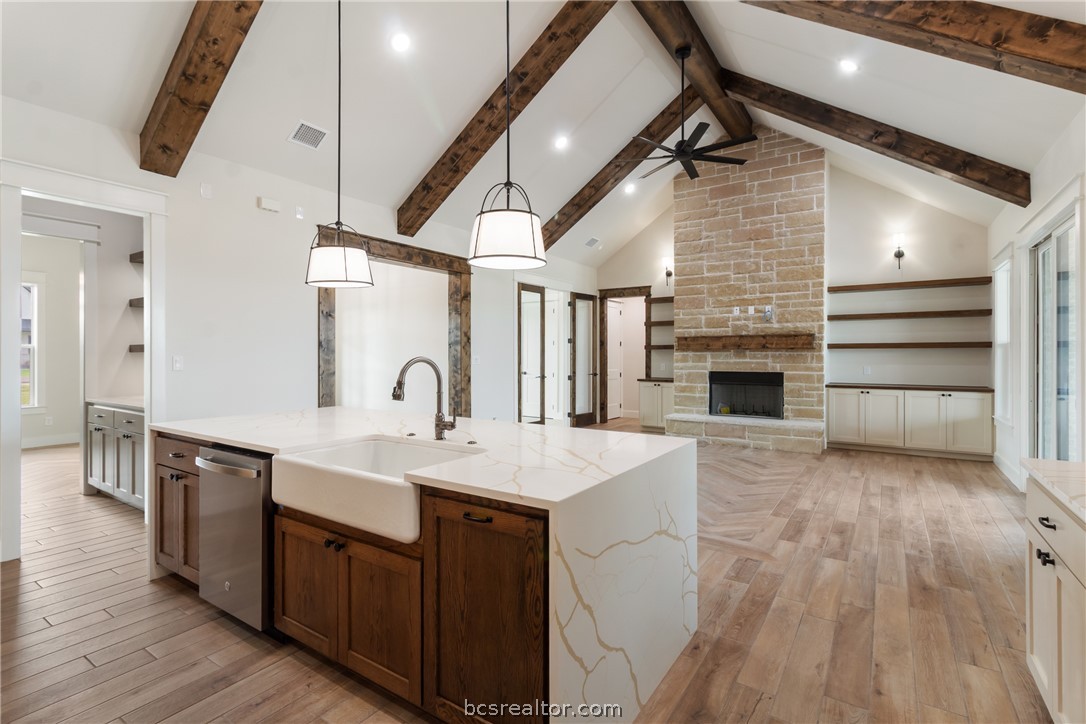 7822 Mathis Crk Drive Bryan, TX 77808 - Photo 9 of 43 a kitchen with a sink appliances and cabinets
