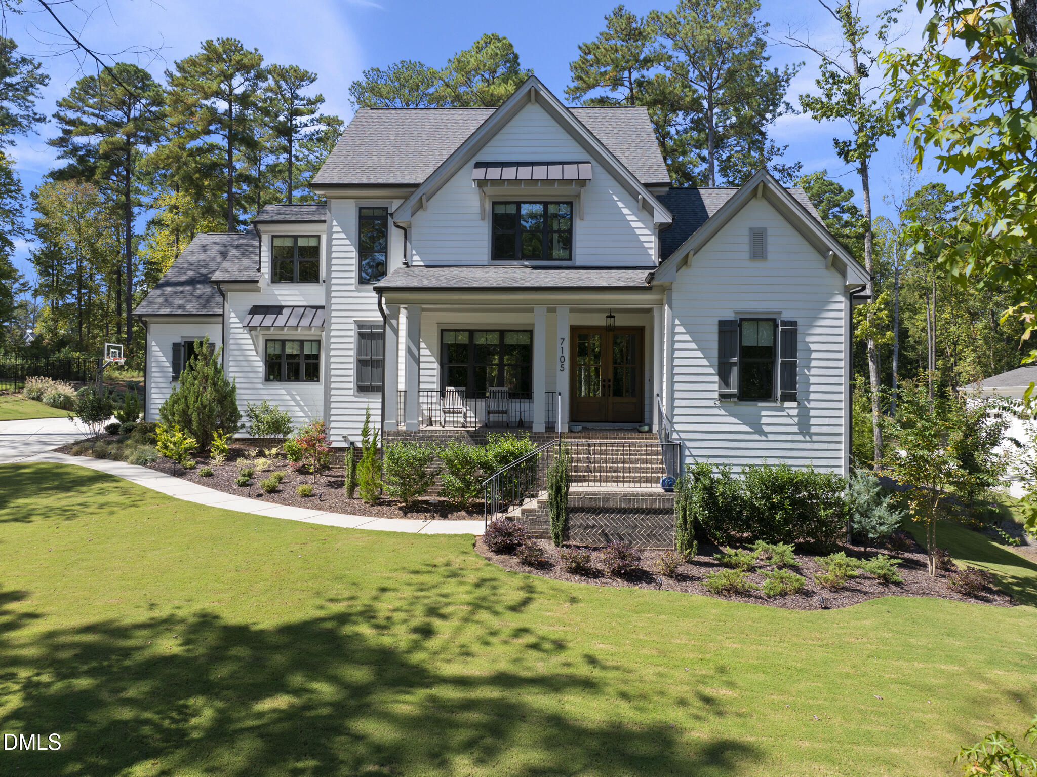 a view of a house with swimming pool and a yard