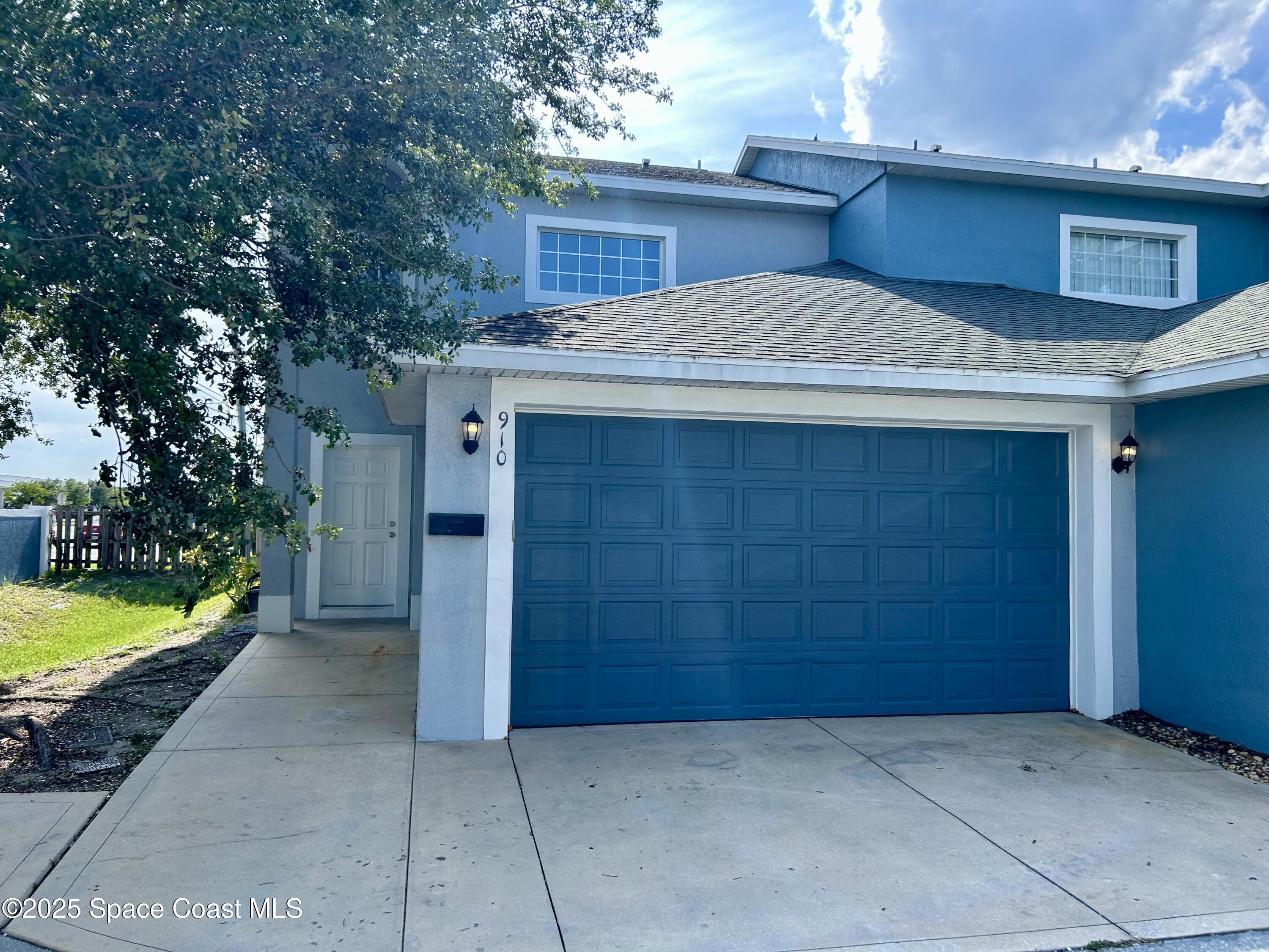 910 Twisting Branch Court Melbourne, FL 32935 - Photo 1 of 24 a view of a house with a tub and trees in the background