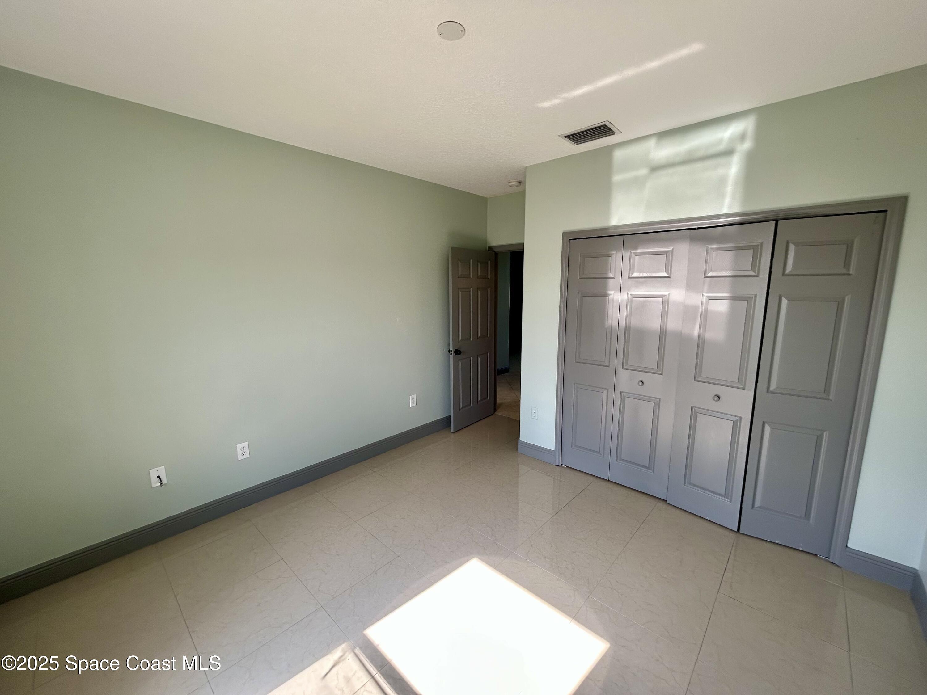 910 Twisting Branch Court Melbourne, FL 32935 - Photo 19 of 24 a view of an empty room