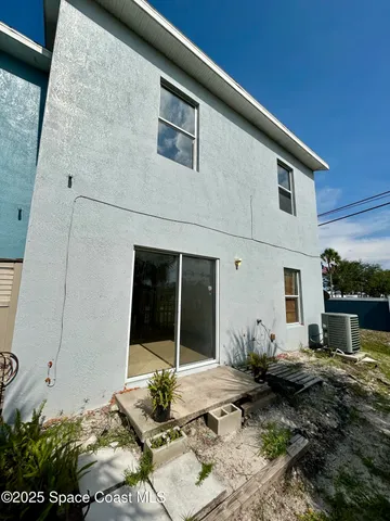 a backyard of a house with garden and patio