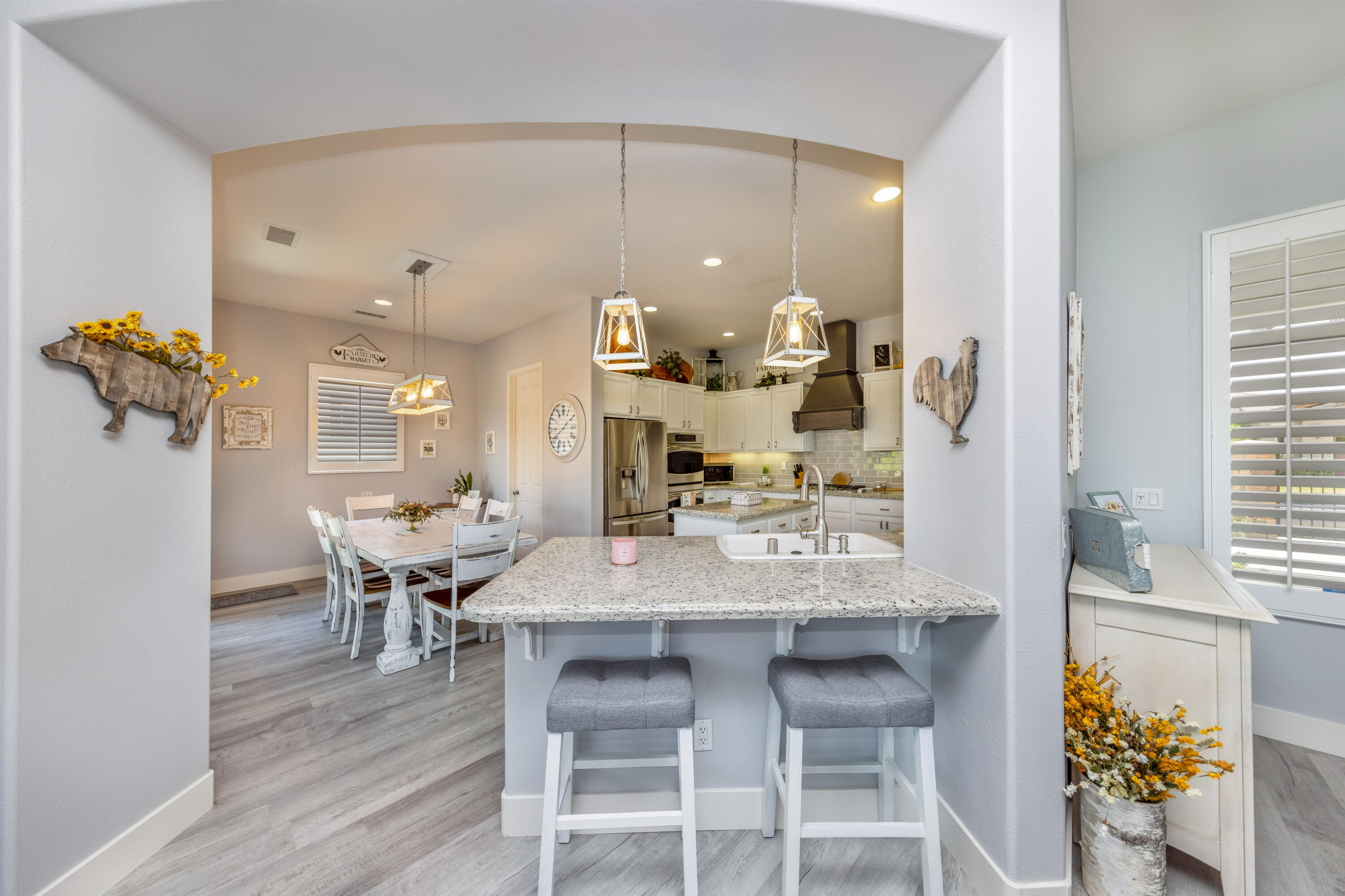 61232 Cactus Spring Drive La Quinta, CA 92253 - Photo 13 of 43 a view of a dining room with furniture and wooden floor