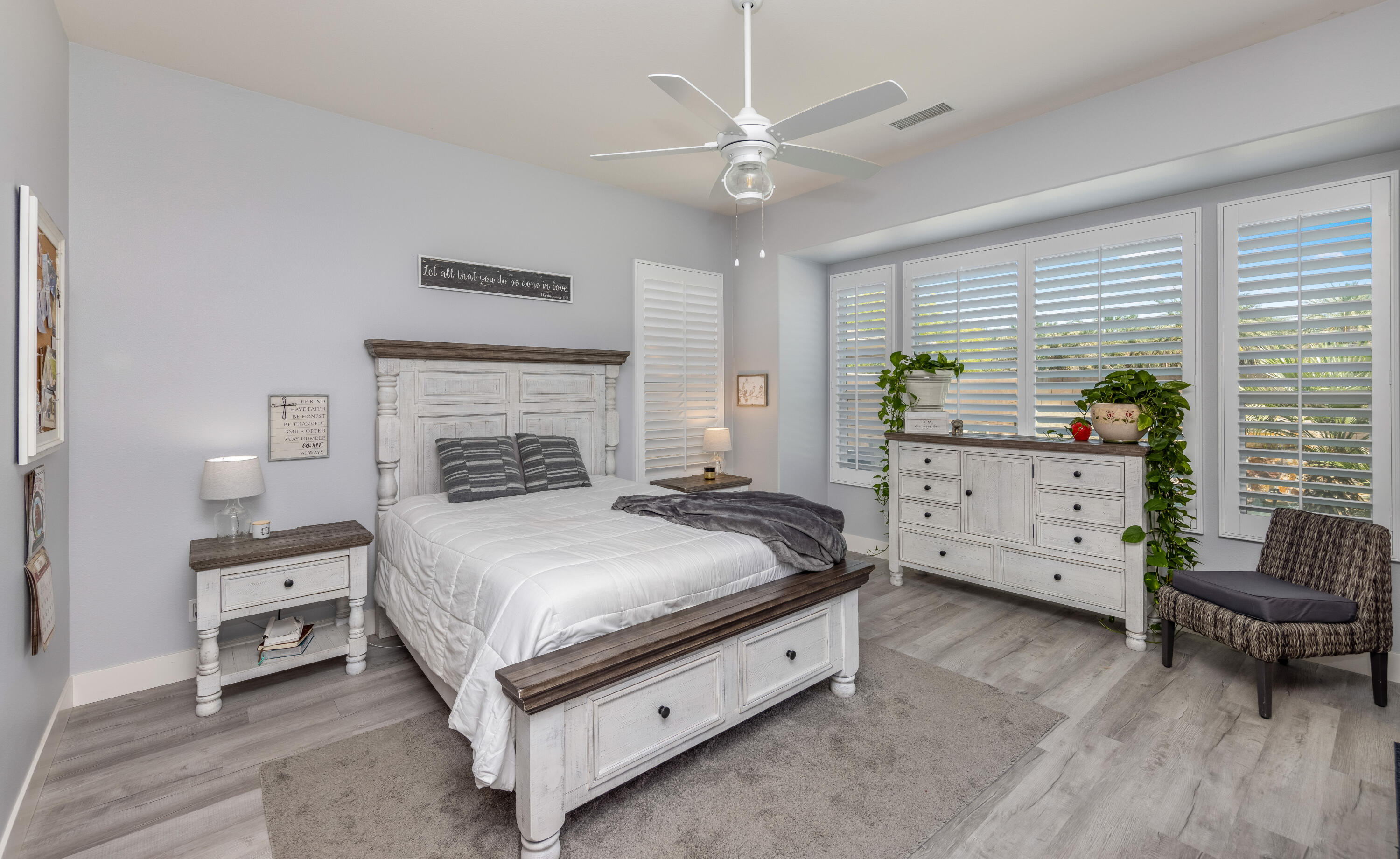 61232 Cactus Spring Drive La Quinta, CA 92253 - Photo 18 of 43 a bedroom with a bed and a couch