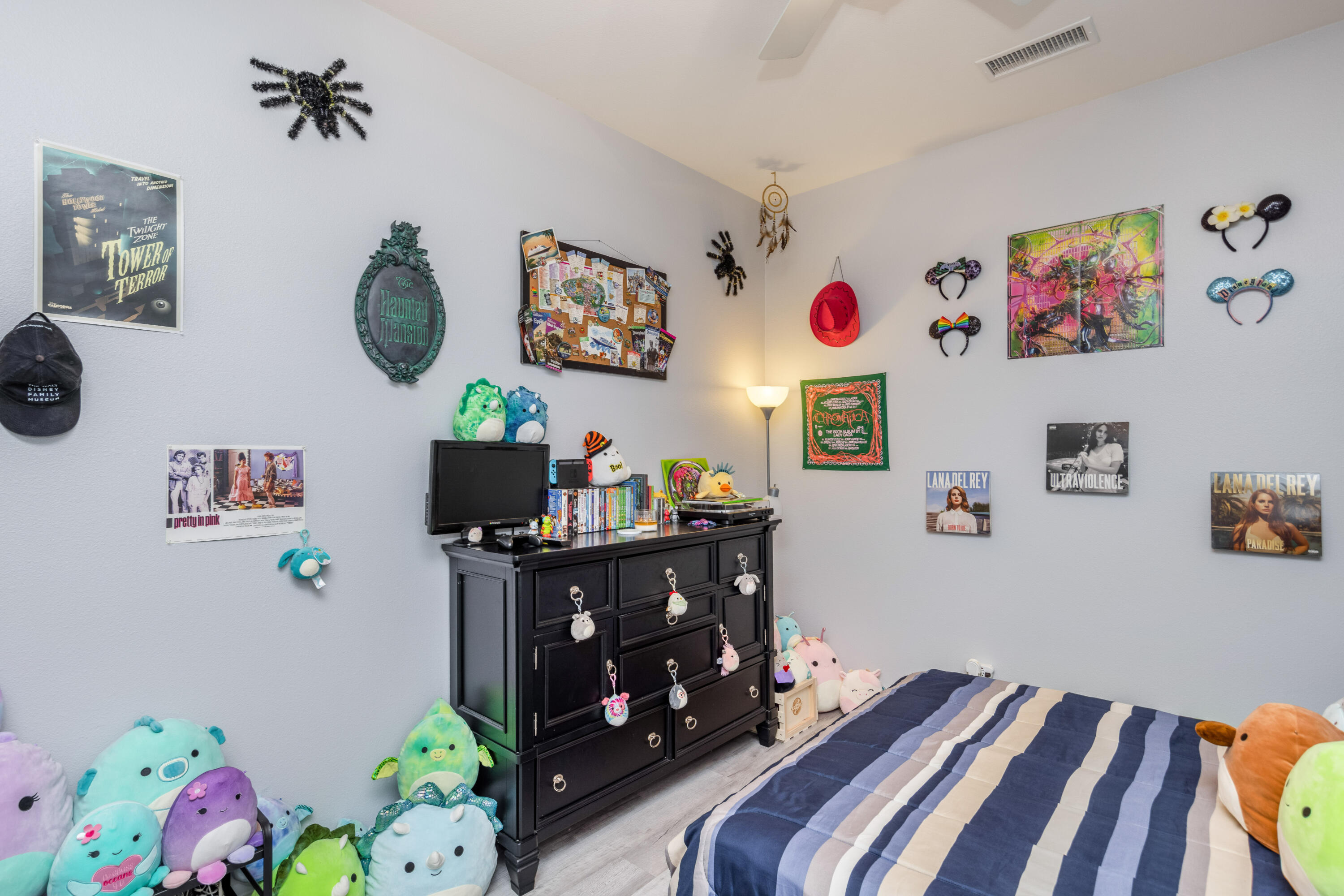 61232 Cactus Spring Drive La Quinta, CA 92253 - Photo 23 of 43 a bedroom with a bed a couch and painting on the wall