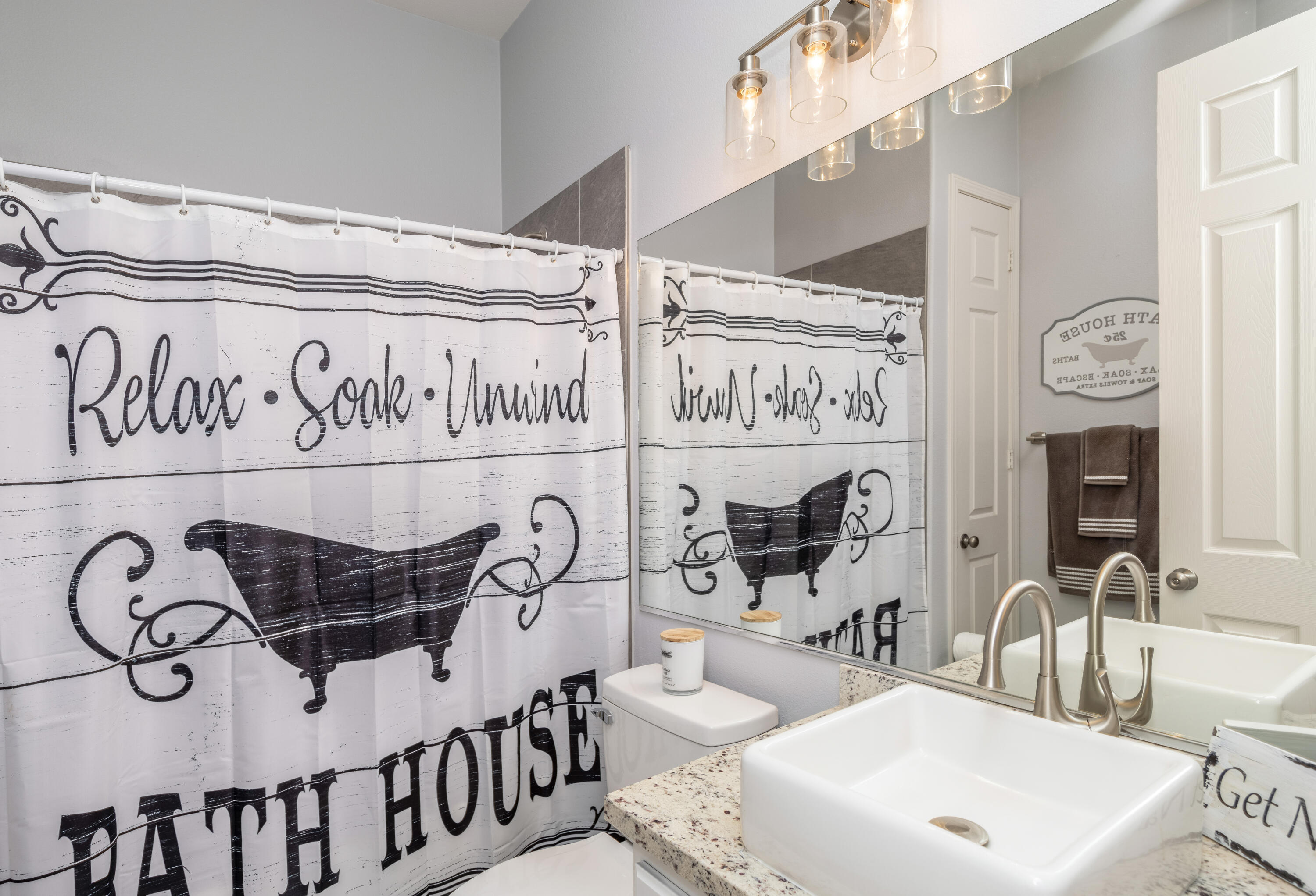 61232 Cactus Spring Drive La Quinta, CA 92253 - Photo 24 of 43 a bathroom with a mirror and a sink