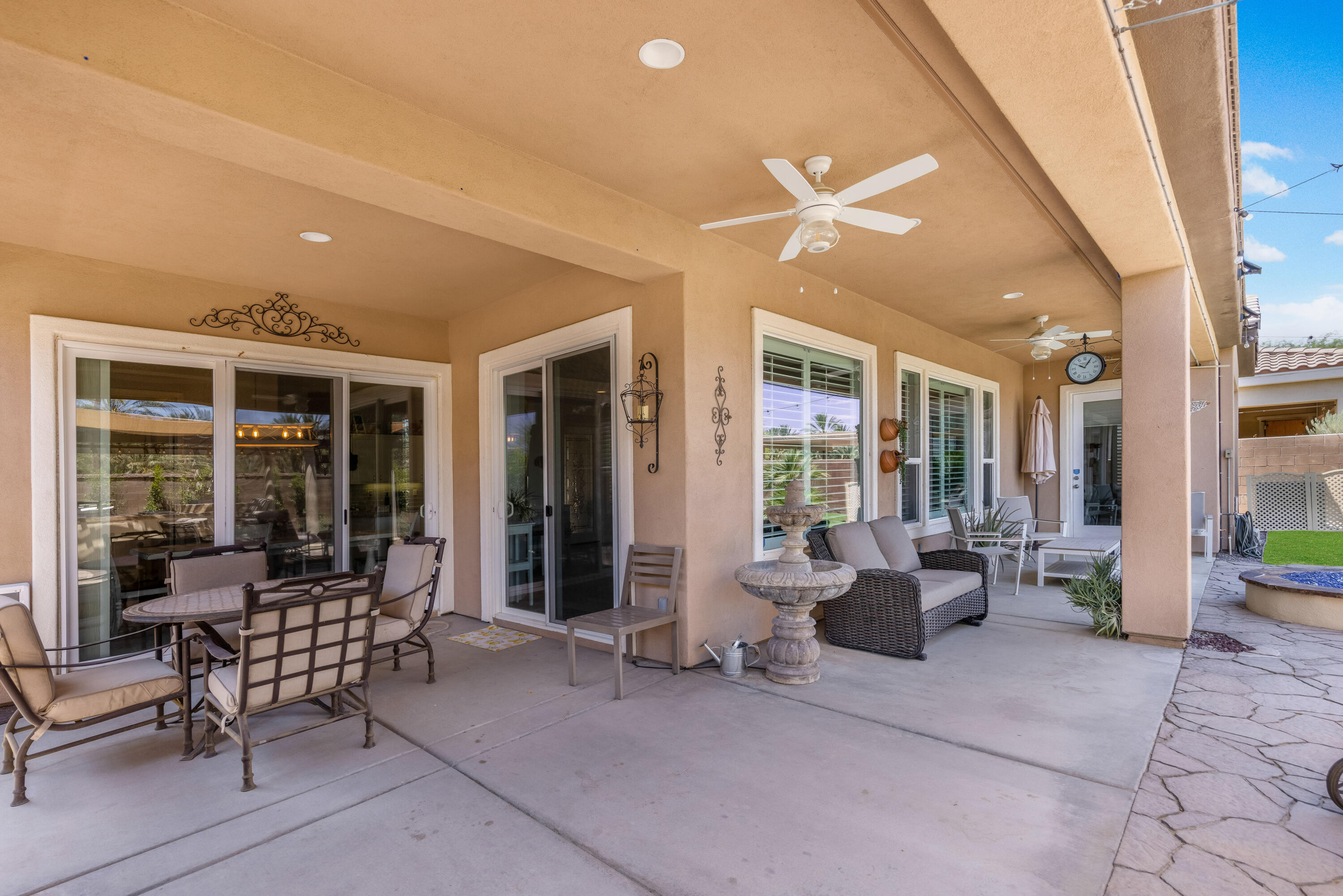 61232 Cactus Spring Drive La Quinta, CA 92253 - Photo 30 of 43 a building outdoor space with patio furniture and potted plants