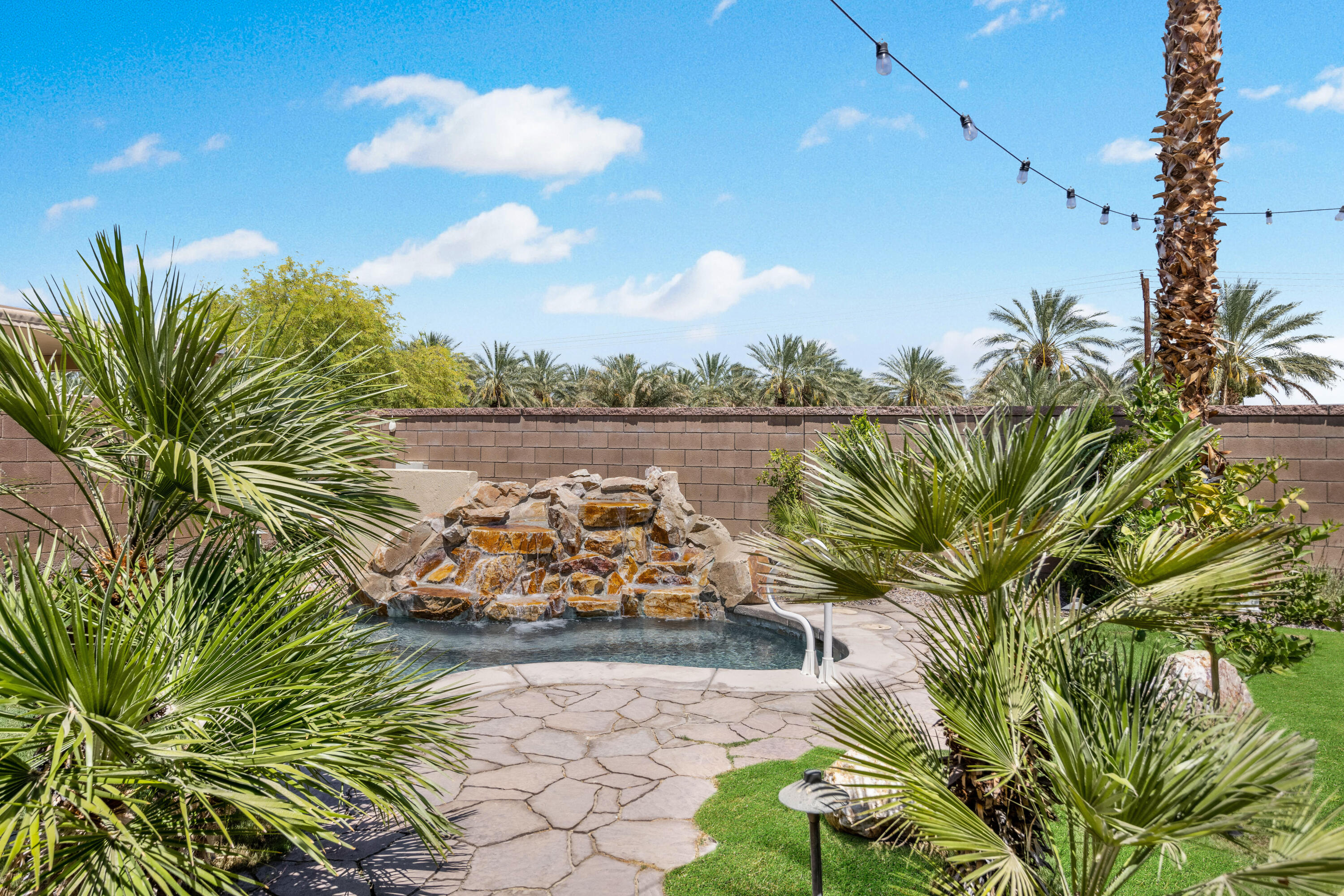 61232 Cactus Spring Drive La Quinta, CA 92253 - Photo 34 of 43 a view of a lake with a garden