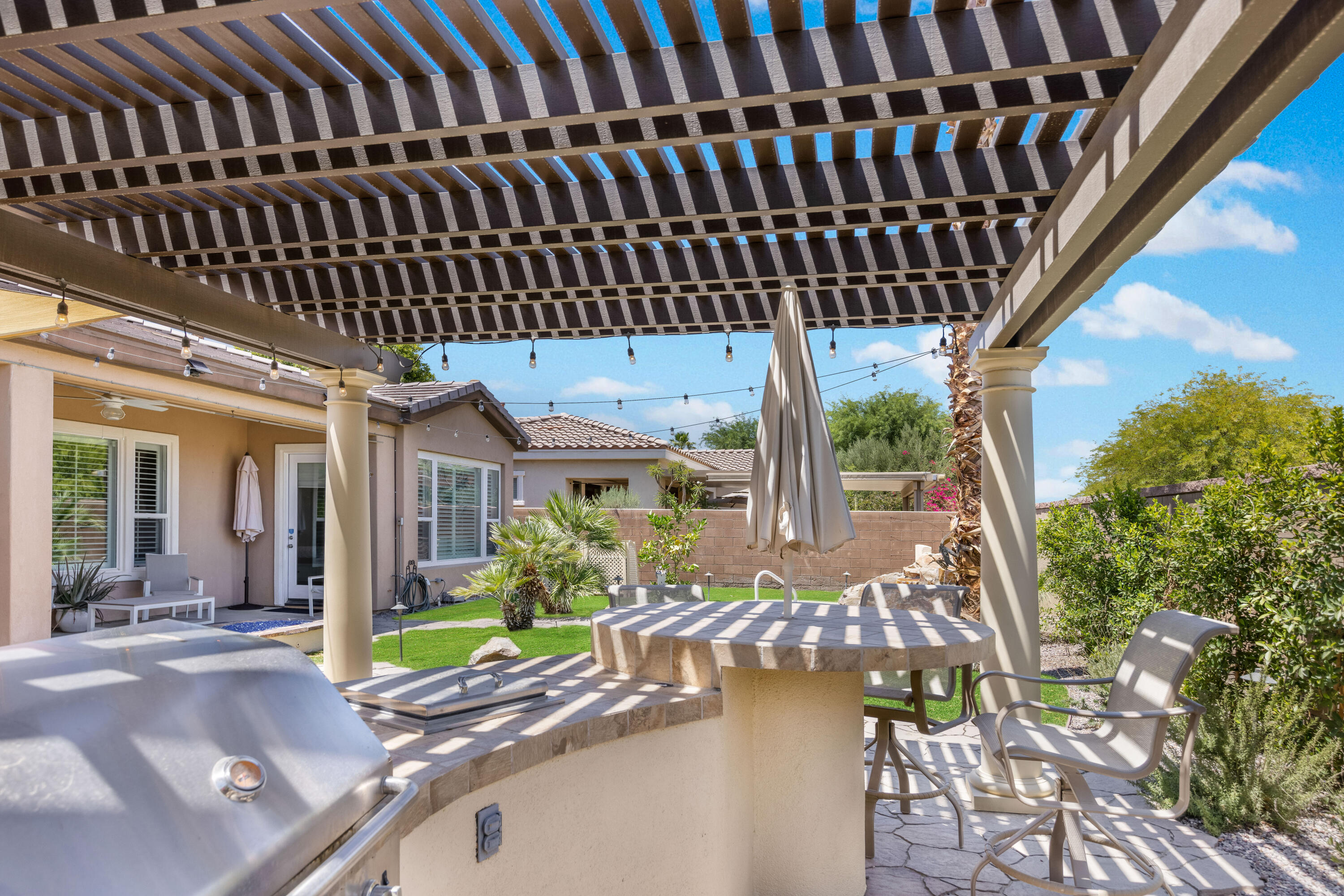 61232 Cactus Spring Drive La Quinta, CA 92253 - Photo 36 of 43 a view of a porch with furniture