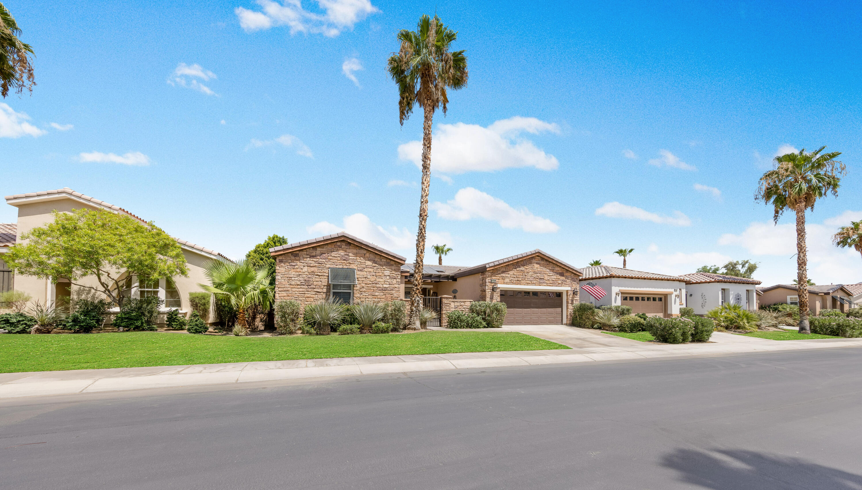 61232 Cactus Spring Drive La Quinta, CA 92253 - Photo 37 of 43 a front view of house with yard and green space