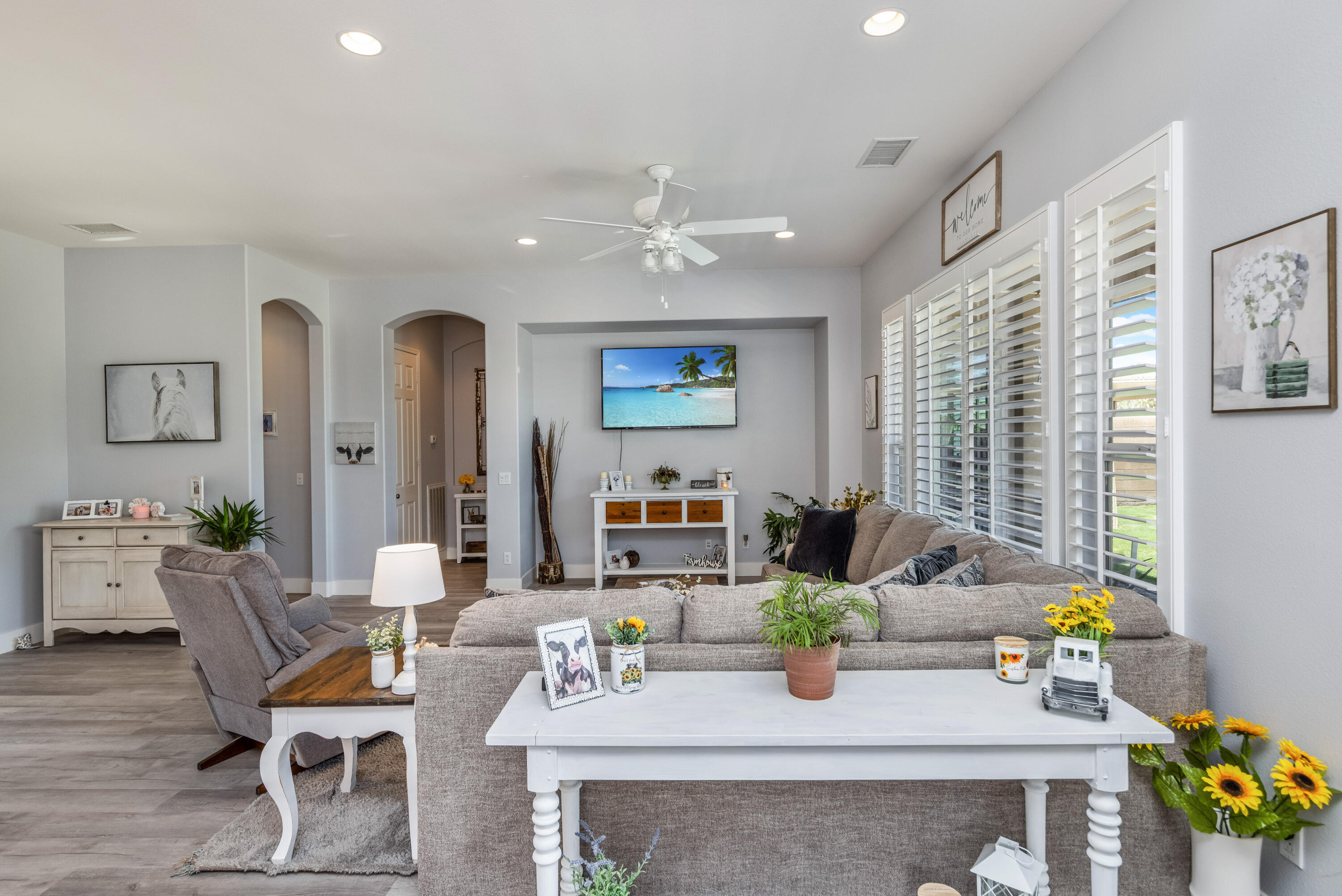 61232 Cactus Spring Drive La Quinta, CA 92253 - Photo 10 of 43 a dining room with wooden floor and glass windows