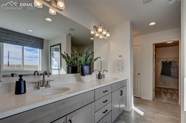 5057 Truscott Road Colorado Springs, CO 80925 - Photo 19 of 48 Bathroom with vanity