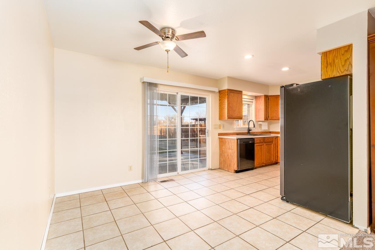 1480 Lattin Road Fallon, NV 89406 - Photo 7 of 31 a kitchen with stainless steel appliances a refrigerator and a sink