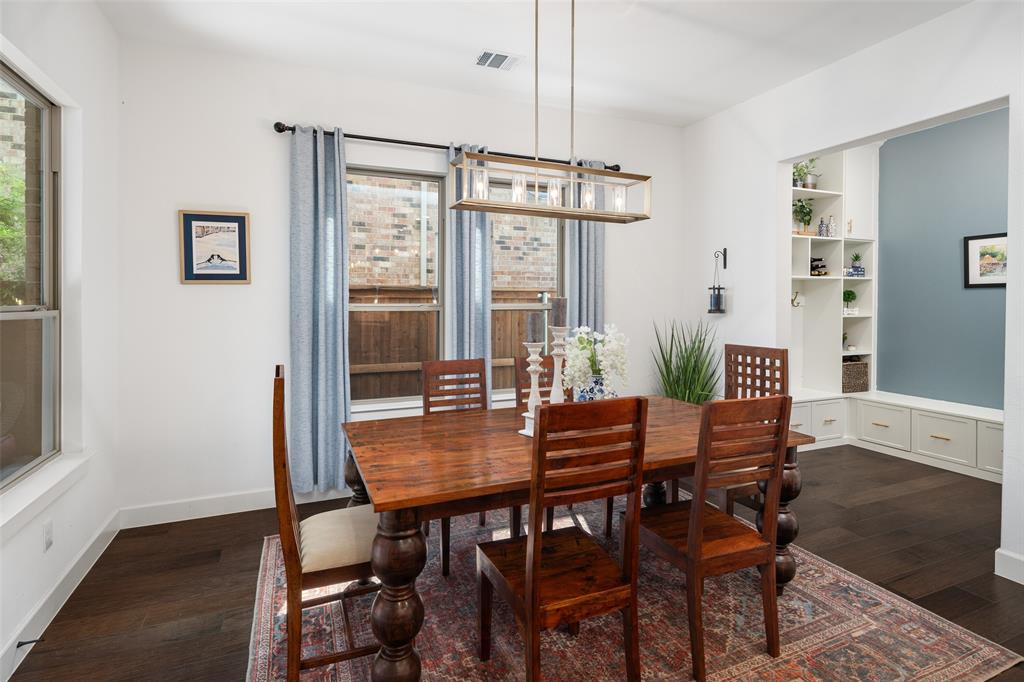 4881 Miles Way Fairview, TX 75069 - Photo 11 of 39 a view of a dining room with furniture window and wooden floor