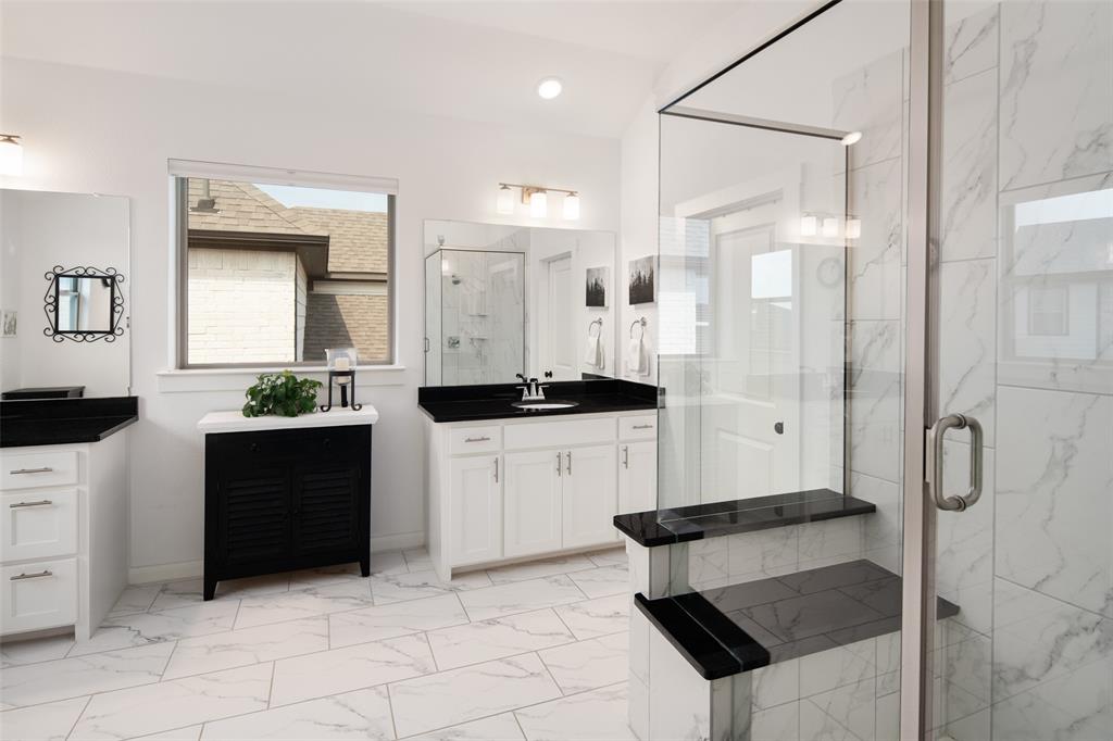 4881 Miles Way Fairview, TX 75069 - Photo 17 of 39 a kitchen with stainless steel appliances a stove a sink and a refrigerator