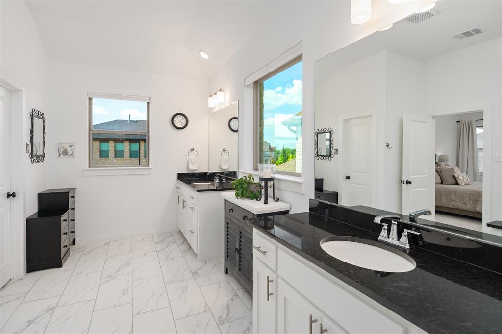 4881 Miles Way Fairview, TX 75069 - Photo 18 of 39 a bathroom with a granite countertop sink mirror and vanity