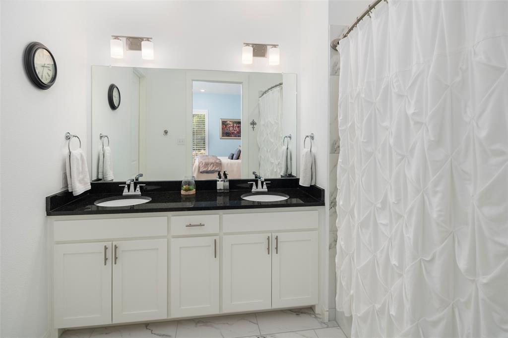 4881 Miles Way Fairview, TX 75069 - Photo 21 of 39 a bathroom with a sink and a mirror