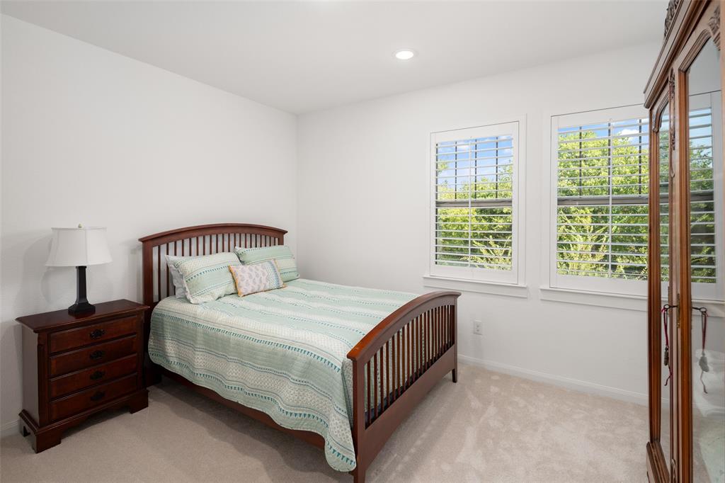 4881 Miles Way Fairview, TX 75069 - Photo 22 of 39 a bedroom with a bed and a window