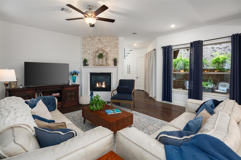 4881 Miles Way Fairview, TX 75069 - Photo 3 of 39 a living room with furniture fireplace and a flat screen tv