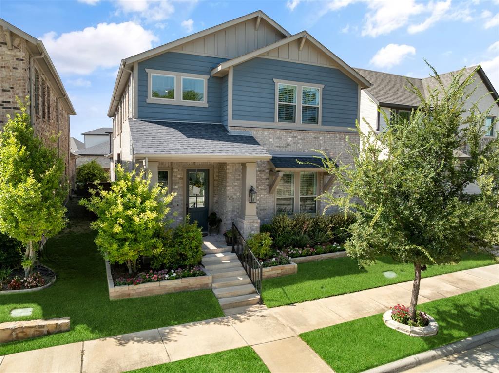 4881 Miles Way Fairview, TX 75069 - Photo 35 of 39 a front view of a house with a yard and potted plants