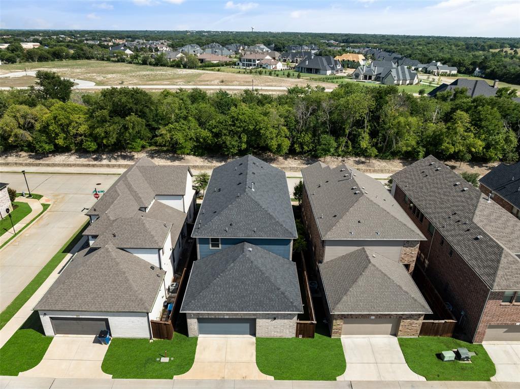 4881 Miles Way Fairview, TX 75069 - Photo 37 of 39 an aerial view of a house with a yard