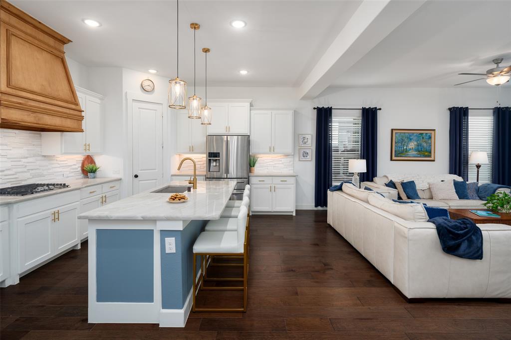 4881 Miles Way Fairview, TX 75069 - Photo 6 of 39 a large kitchen with a table and chairs