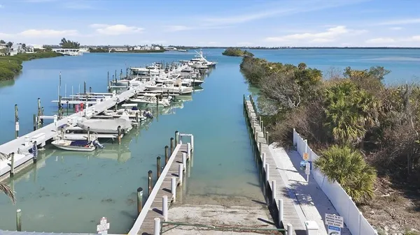 an aerial view of a houses with ocean view