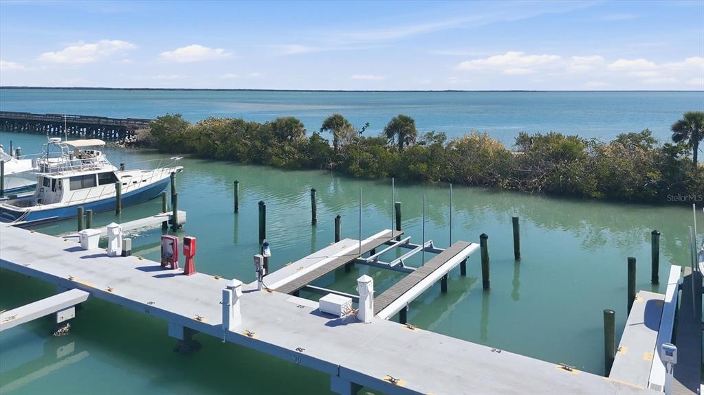 5820 Gasparilla Road, Unit SLIP 25 Boca Grande, FL 33921 - Photo 2 of 24 a view of a lake from a balcony