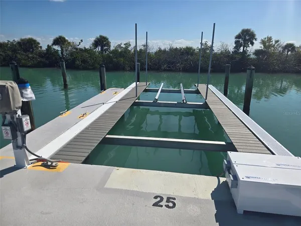 a view of a wooden deck with lake view