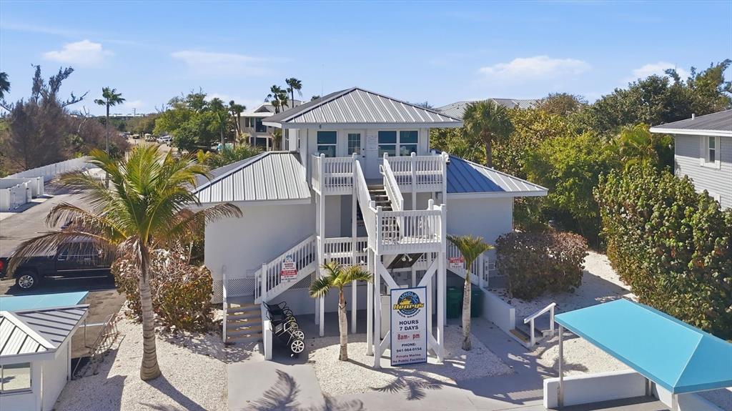 5820 Gasparilla Road, Unit SLIP 25 Boca Grande, FL 33921 - Photo 9 of 24 a front view of a house with garden
